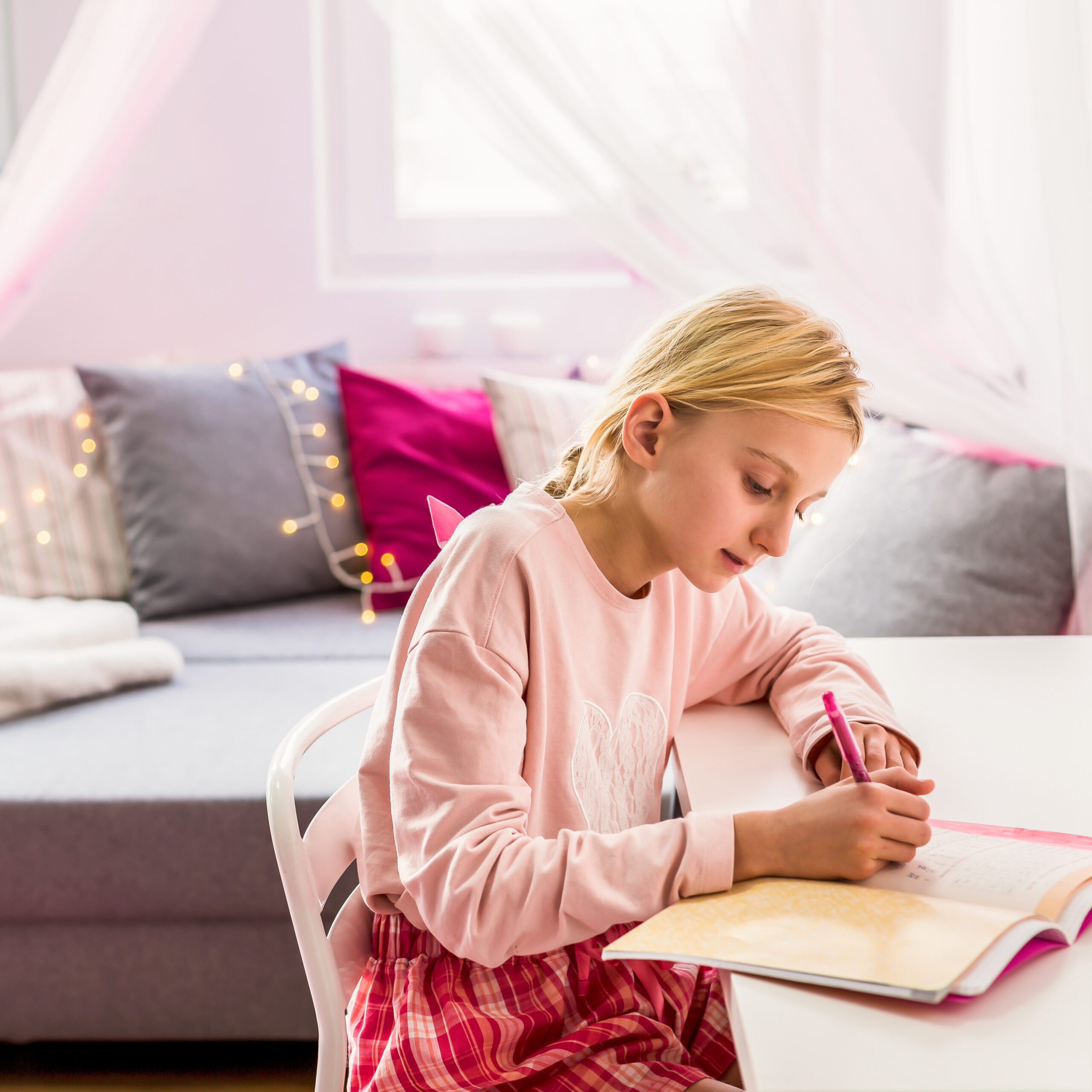 Little girl writing diary